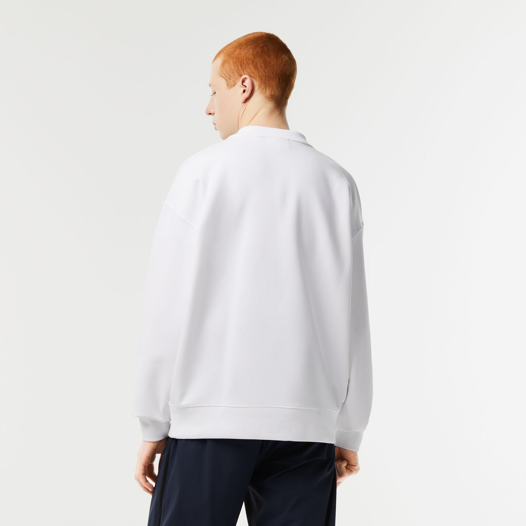 سويت شيرت لاكوست بقصة فضفاضة وشعار الماركة للرجال