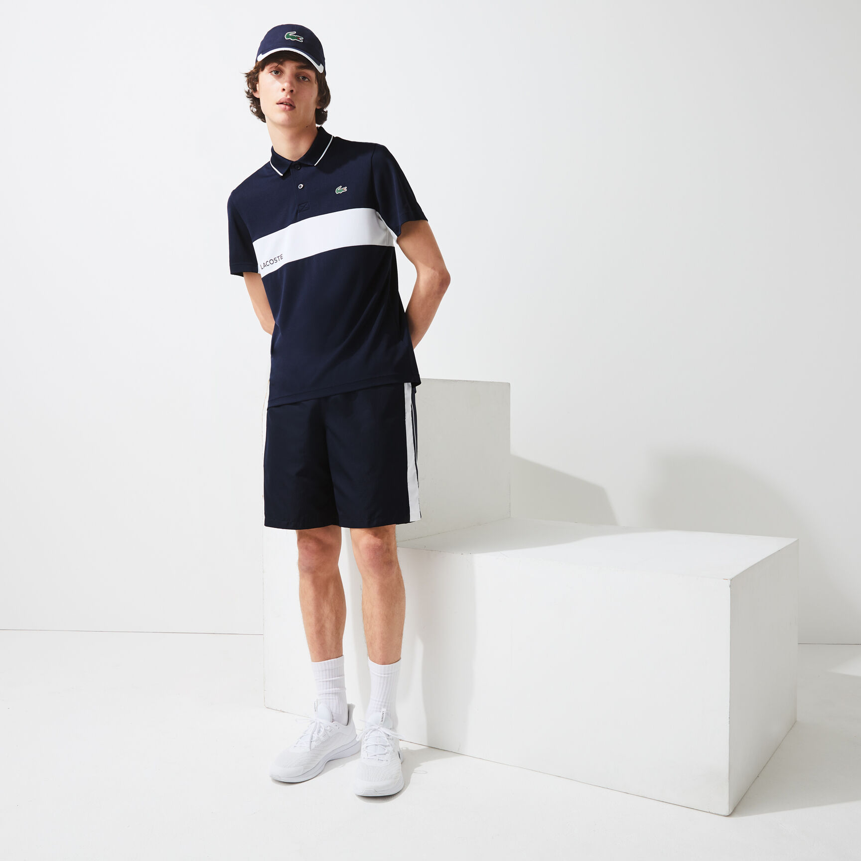 قميص بولو مقاوم مسامي للرجال مع كتل لونية مجموعة Lacoste SPORT