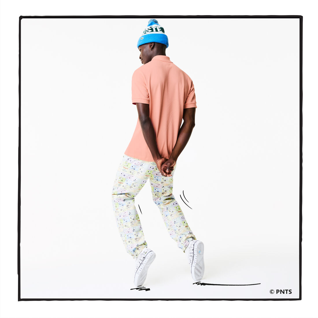 قميص بولو من القطن العضوي الرجالي من مجموعة Lacoste x Peanuts قميص بولو من القطن العضوي الرجالي من مجموعة Lacoste x Peanuts