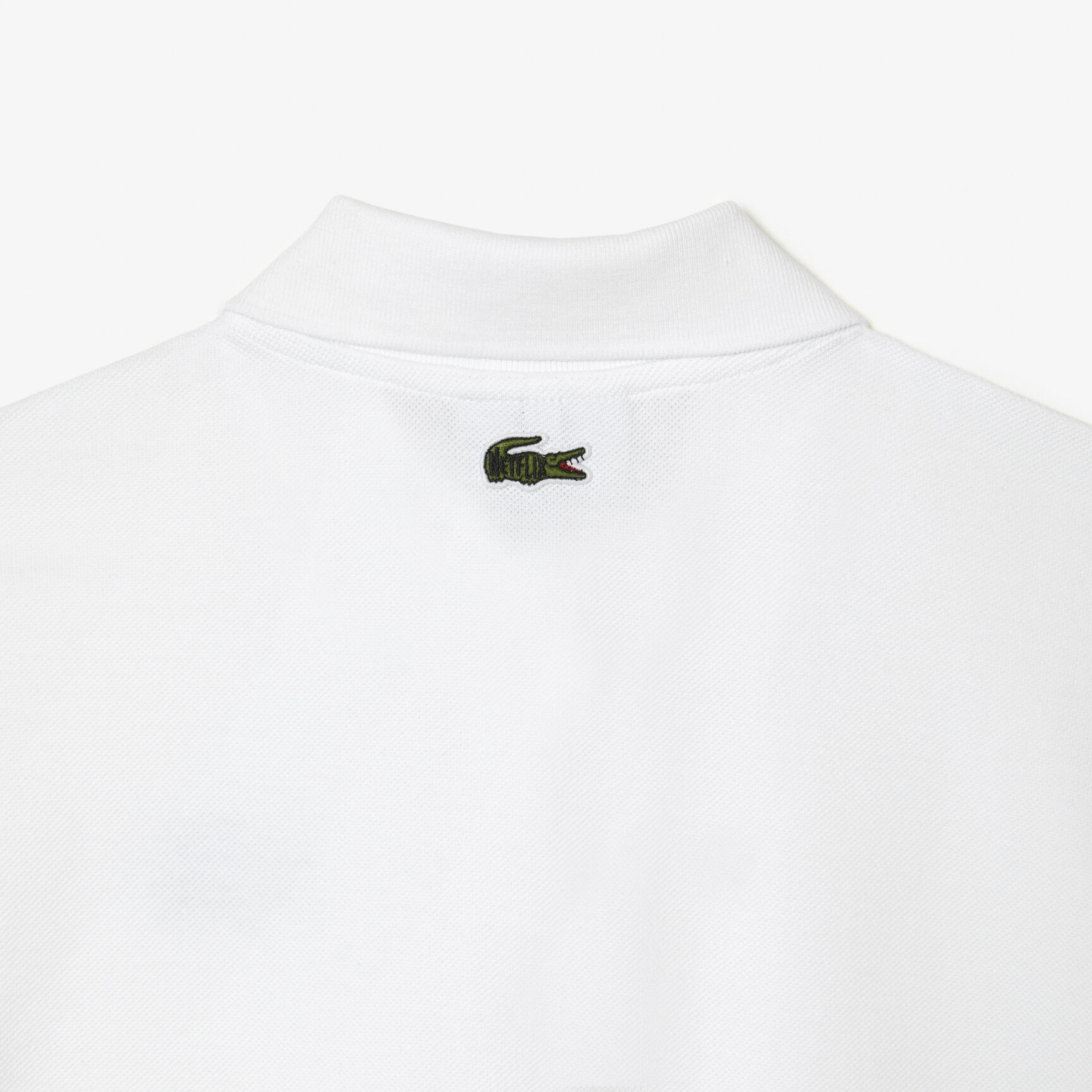 تيشيرت بولو بطبعة تمساح للنساء مجموعة Lacoste x Netflix تيشيرت بولو بطبعة تمساح للنساء مجموعة Lacoste x Netflix
