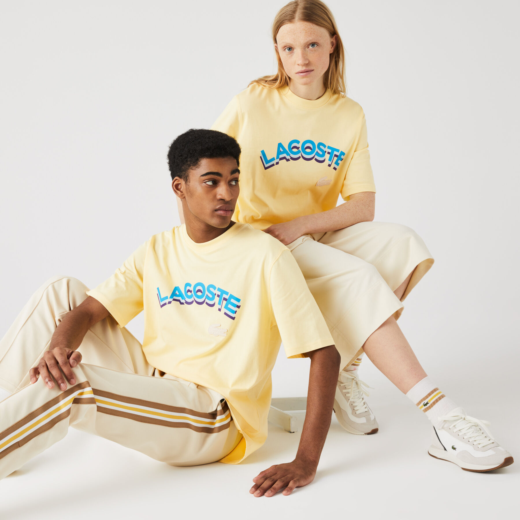 لاكوست تي شيرت قطن للجنسين بحروف وقصة فضفاضة مجموعة lacoste live