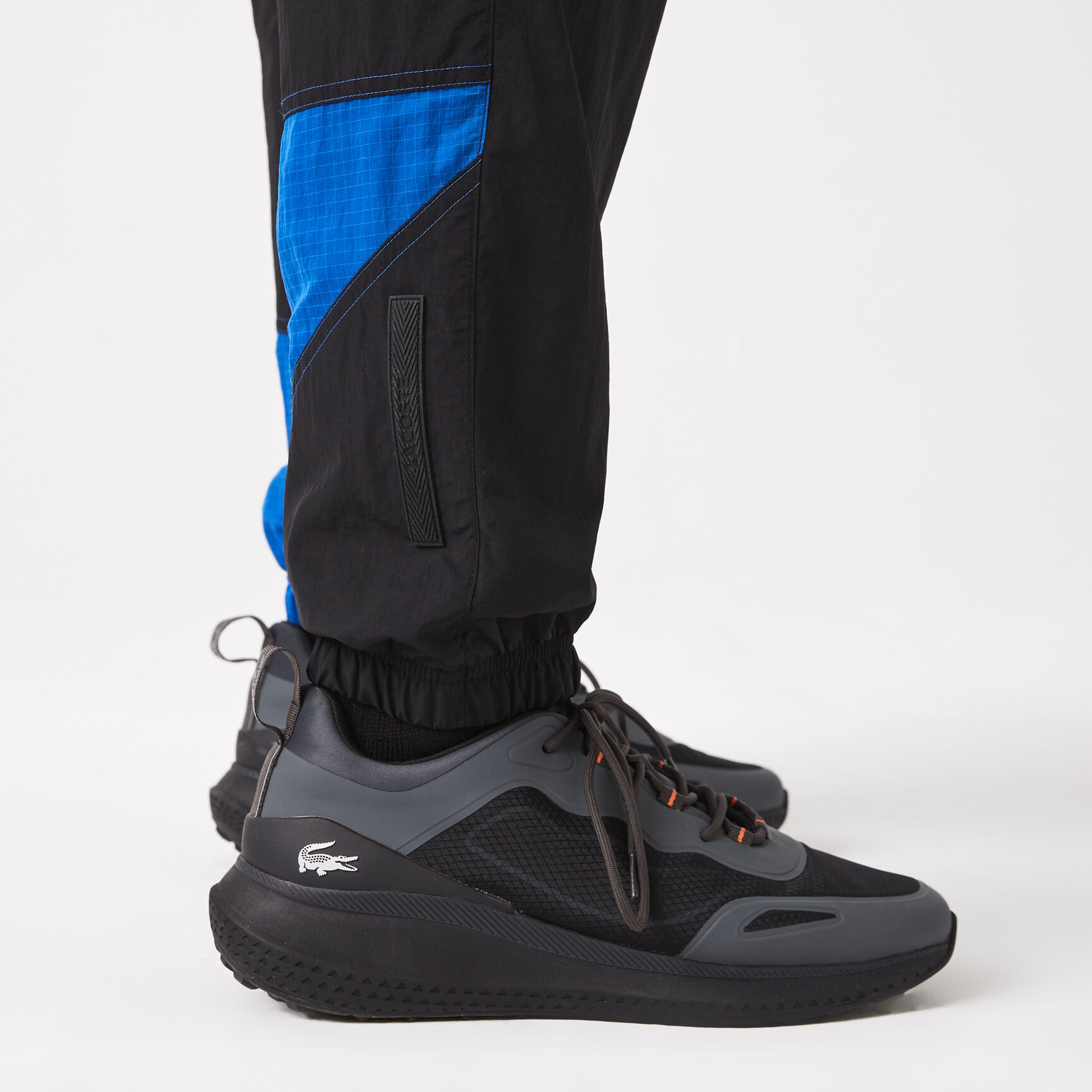 بنطال رياضي لاكوست مقسم لأجزاء ومقاوم للماء للرجال بنطال رياضي لاكوست مقسم لأجزاء ومقاوم للماء للرجال