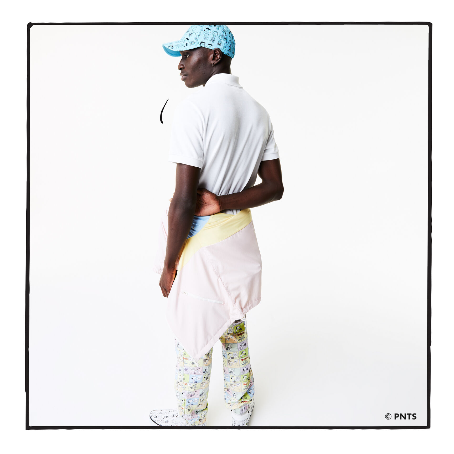 قميص بولو من القطن العضوي الرجالي من مجموعة Lacoste x Peanuts قميص بولو من القطن العضوي الرجالي من مجموعة Lacoste x Peanuts