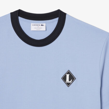 تيشيرت فرنسي الصنع مزين بشعار المااركة