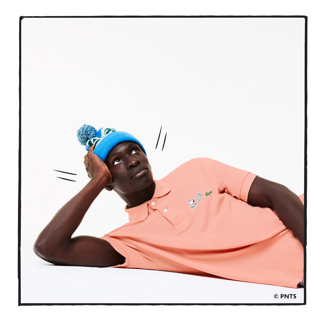 قميص بولو من القطن العضوي الرجالي من مجموعة Lacoste x Peanuts