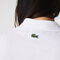 قميص بولو بأنماط مونوغرام وقصة ضيقة مجموعة Lacoste LIVE للنساء