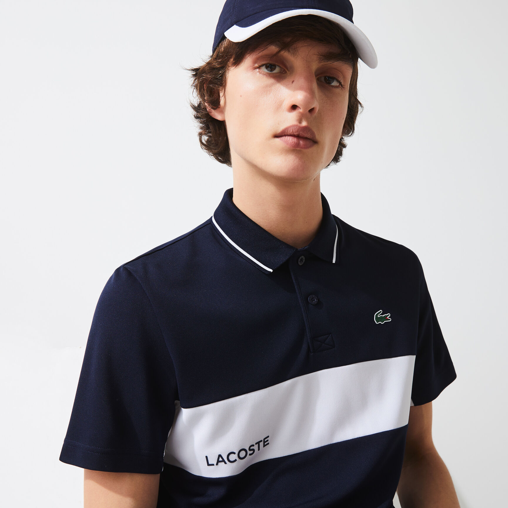 قميص بولو مقاوم مسامي للرجال مع كتل لونية مجموعة Lacoste SPORT