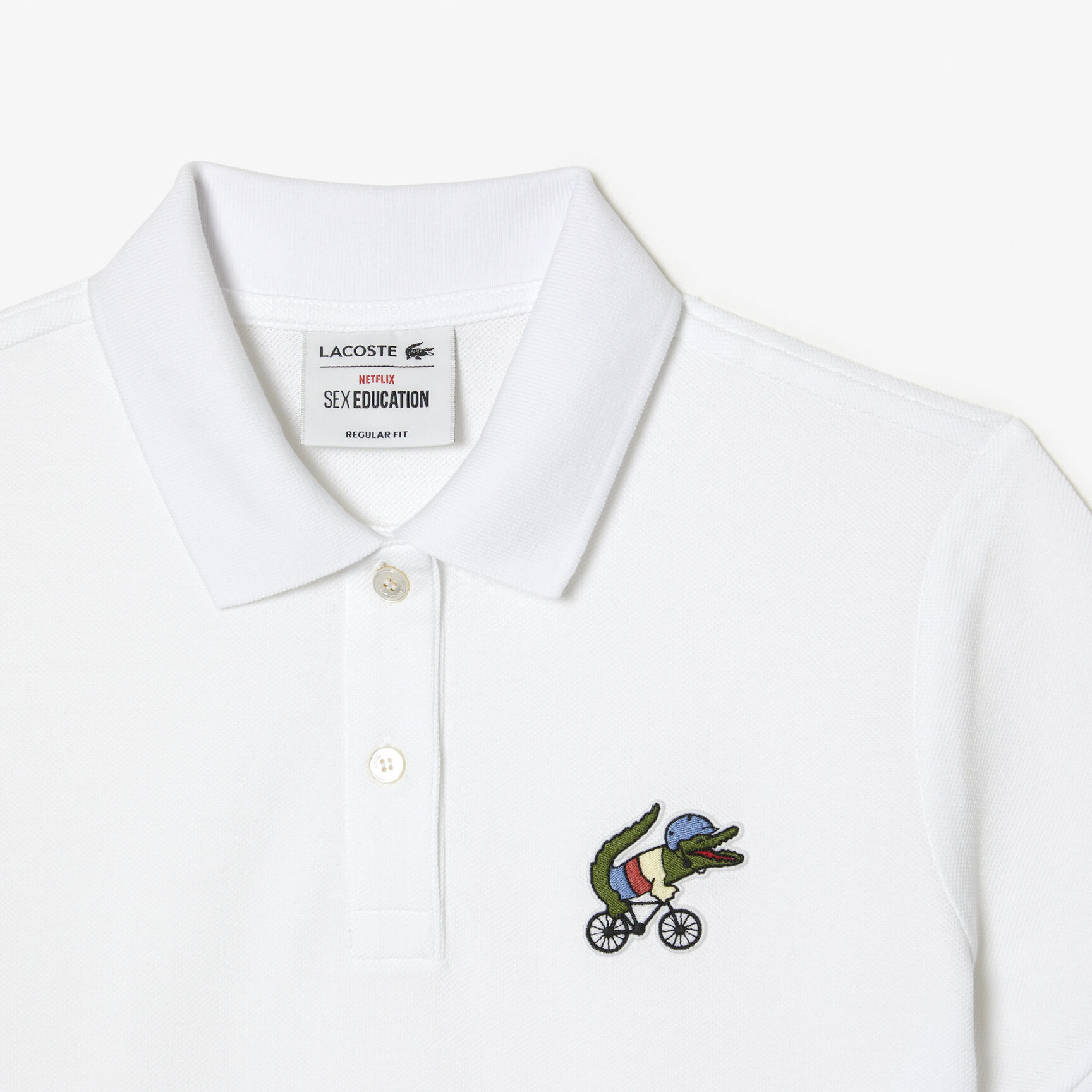 تيشيرت بولو بطبعة تمساح للنساء مجموعة Lacoste x Netflix تيشيرت بولو بطبعة تمساح للنساء مجموعة Lacoste x Netflix