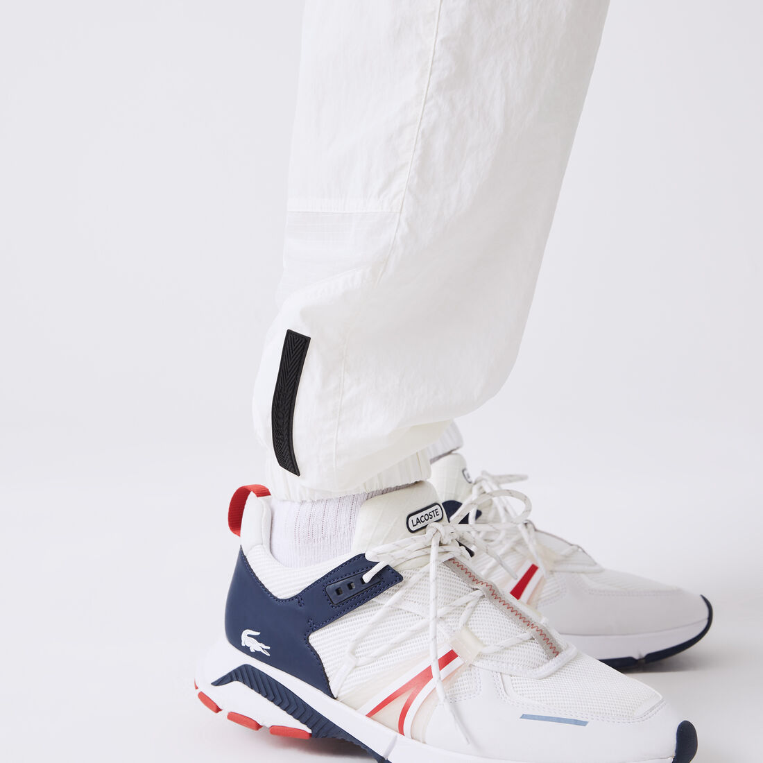 بنطال رياضي لاكوست مقسم لأجزاء ومقاوم للماء للرجال بنطال رياضي لاكوست مقسم لأجزاء ومقاوم للماء للرجال