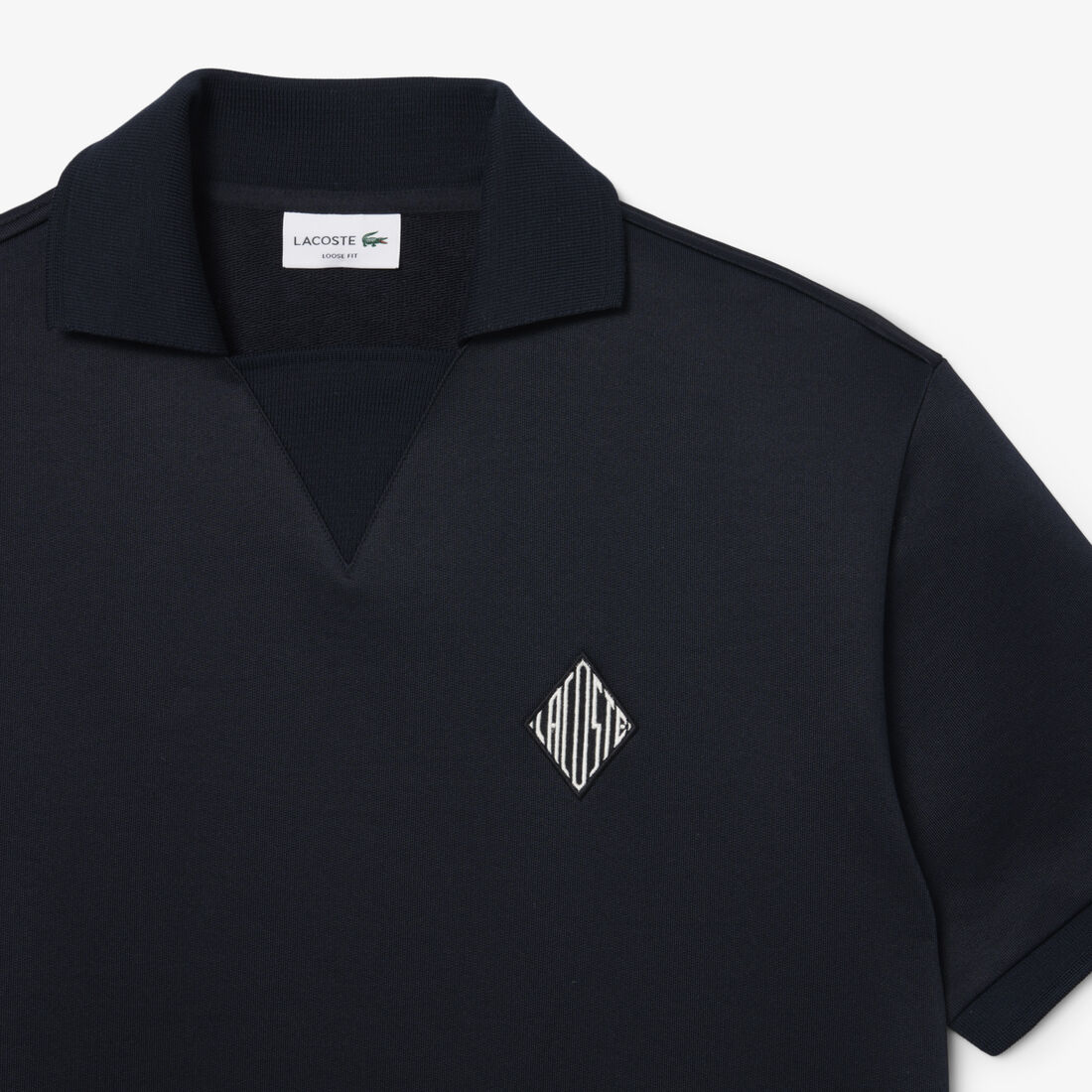 قميص بولو من الصوف بقصة فضفاضة مزين بشعار مميز Loose Fit Badge Accent Fleece Polo Shirt - DH1208-00-350