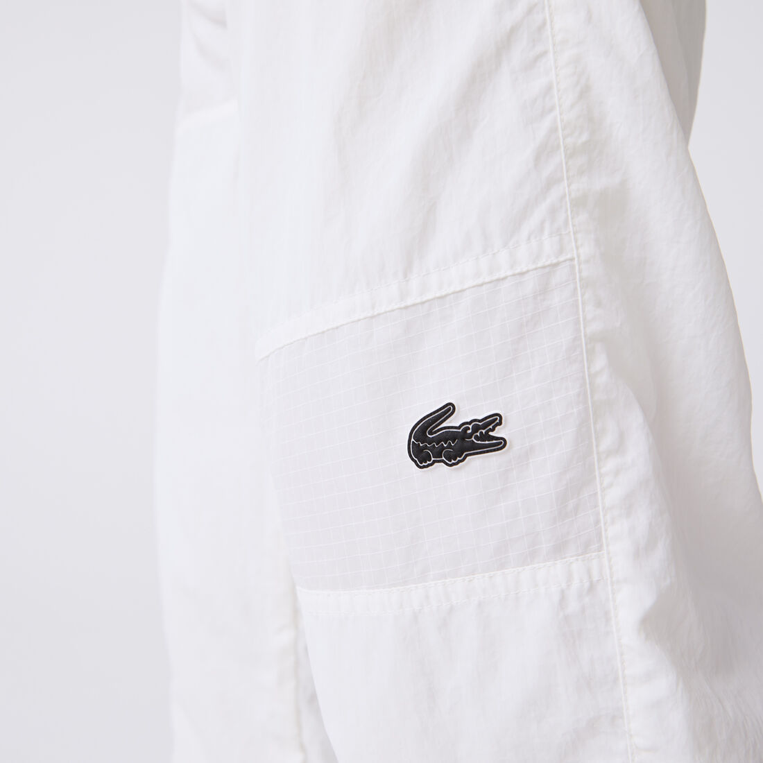 بنطال رياضي لاكوست مقسم لأجزاء ومقاوم للماء للرجال بنطال رياضي لاكوست مقسم لأجزاء ومقاوم للماء للرجال