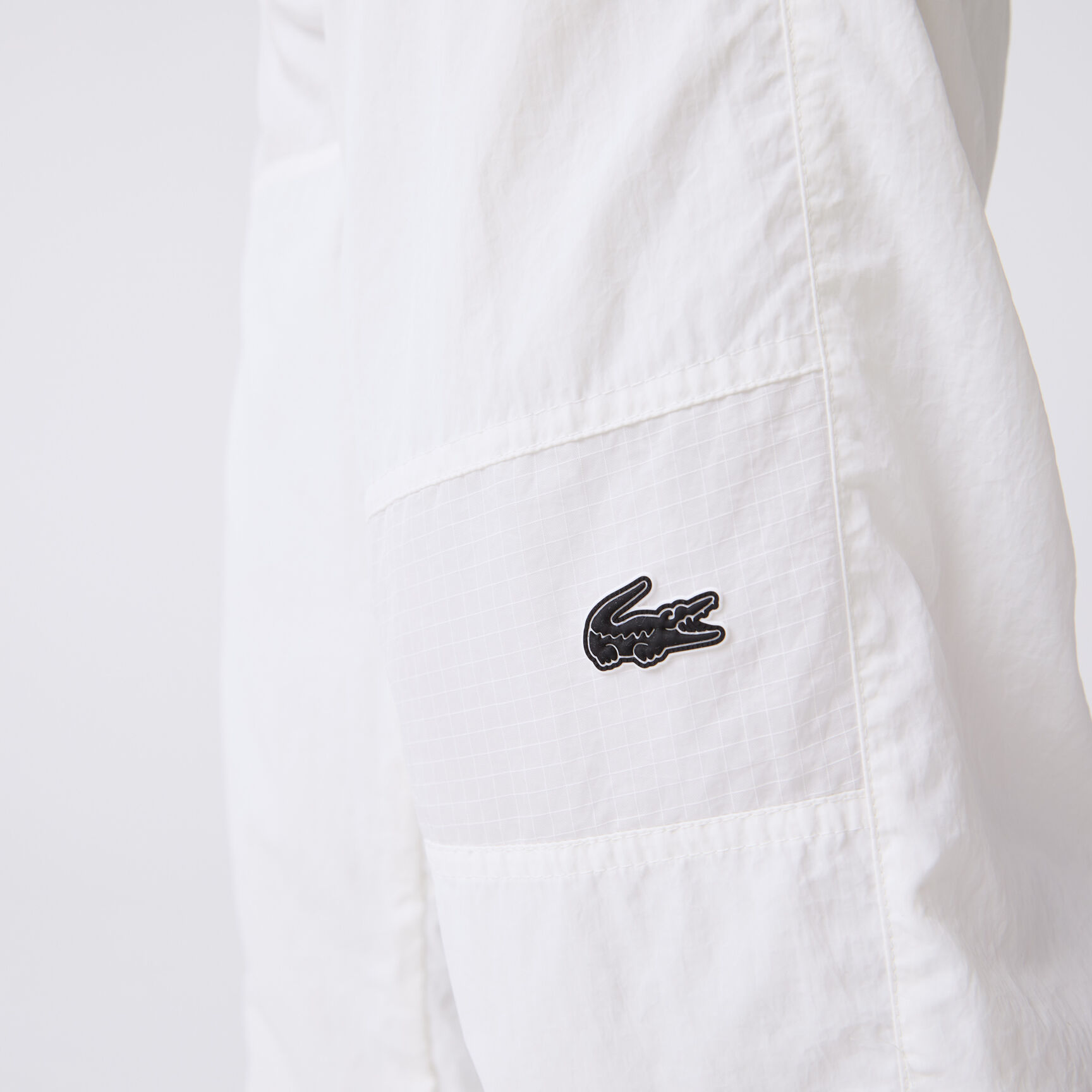 بنطال رياضي لاكوست مقسم لأجزاء ومقاوم للماء للرجال بنطال رياضي لاكوست مقسم لأجزاء ومقاوم للماء للرجال