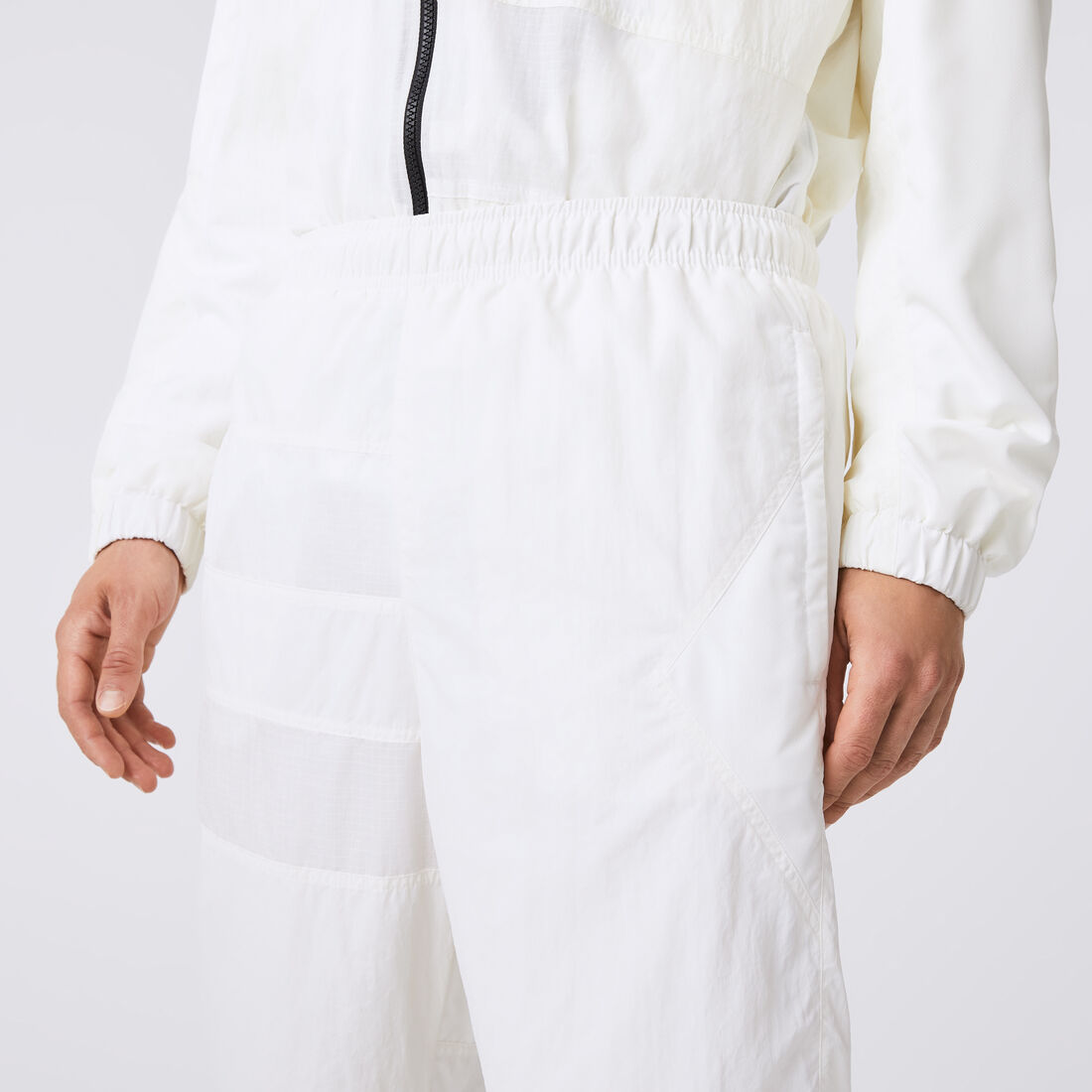 بنطال رياضي لاكوست مقسم لأجزاء ومقاوم للماء للرجال بنطال رياضي لاكوست مقسم لأجزاء ومقاوم للماء للرجال