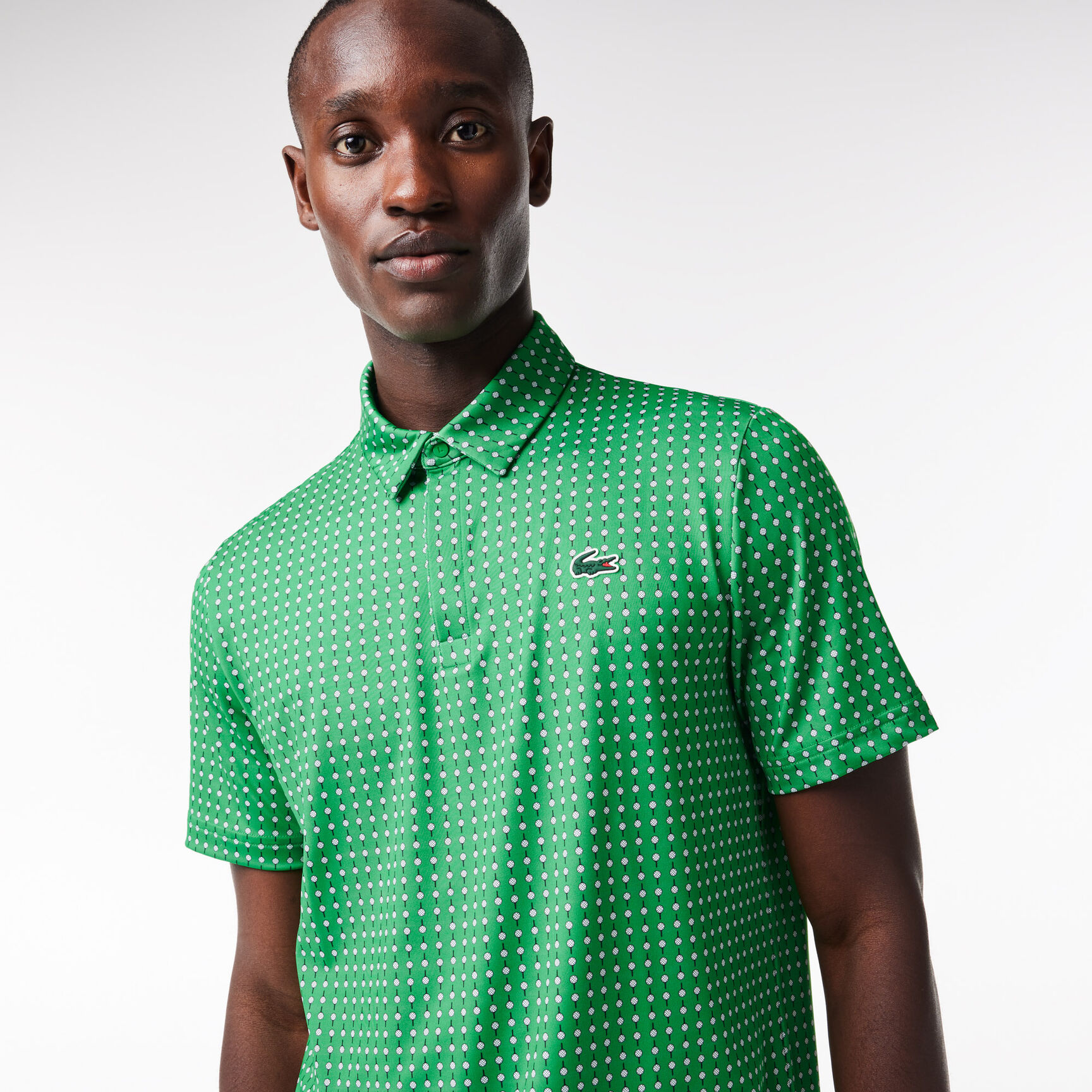 تي شيرت بولو قطن مطاطي بقصّة عادية ومزين بشريط يحمل كلمة Lacoste Men's Lacoste Golf Printed Recycled Polyester Polo Shirt - DH5175-00-QBI